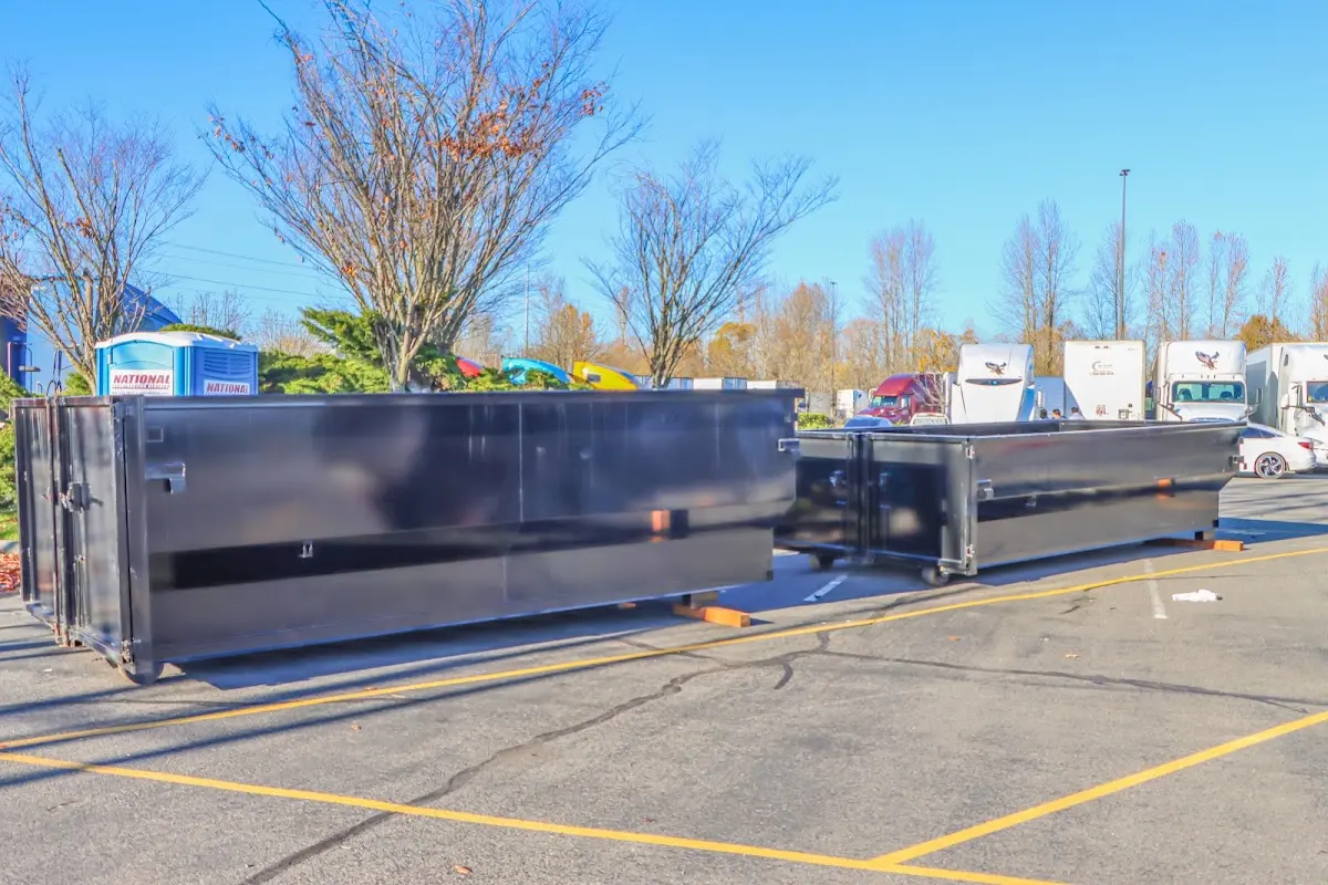 Professional dumpster rental service with roll-off container on residential driveway in McLean